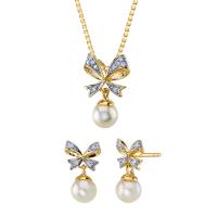 Kolekcia perlových šperkov so zlatými mašľami a zirkónmi Julissa