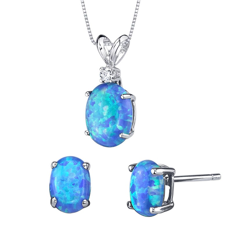Zlatá kolekcia šperkov s modrými oválnymi opálmi a diamantom Saliha